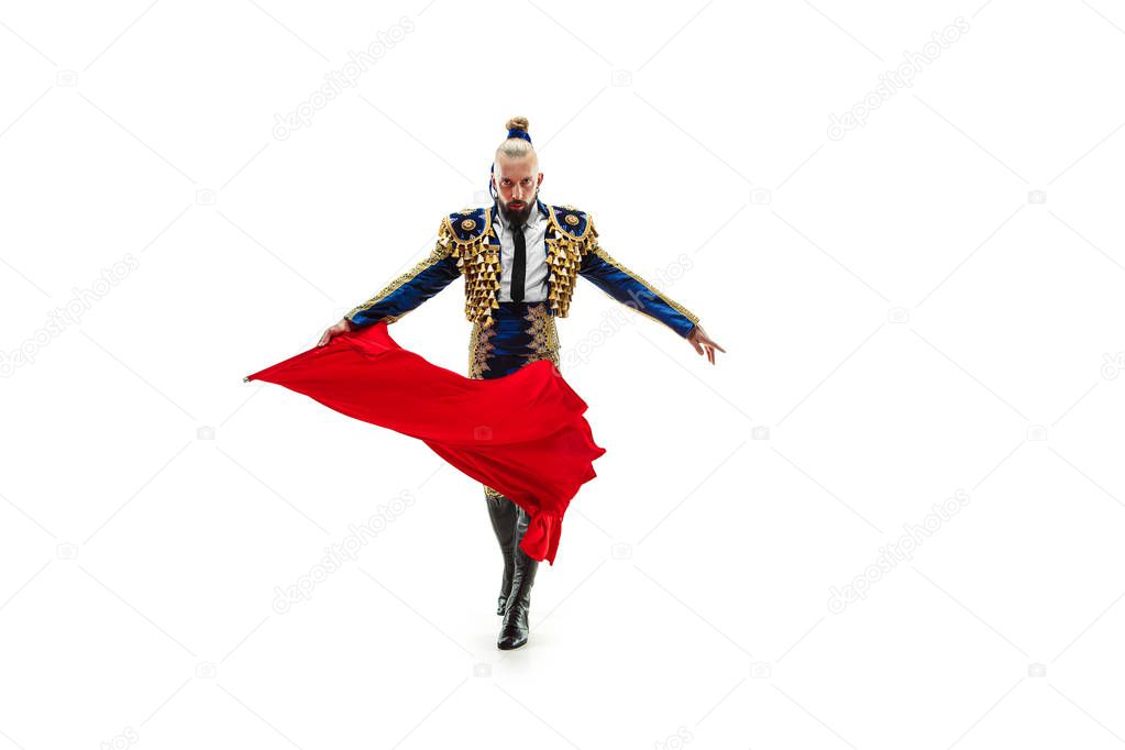 Torero in blue and gold suit or typical spanish bullfighter isolated over white