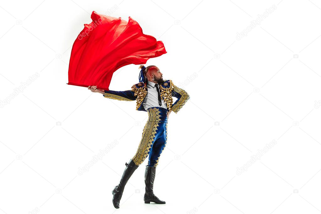 Torero in blue and gold suit or typical spanish bullfighter isolated over white