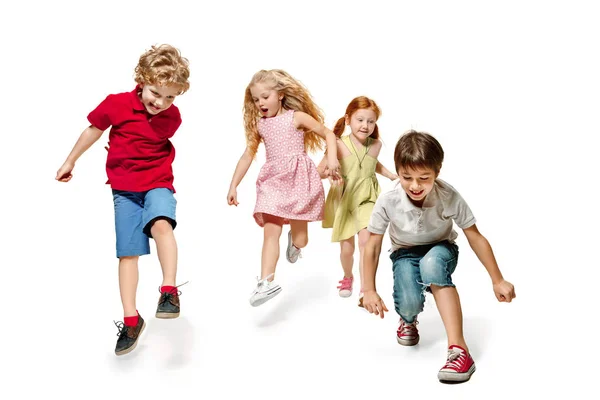 Group of fashion cute preschooler kids friends running together — Stock Photo, Image
