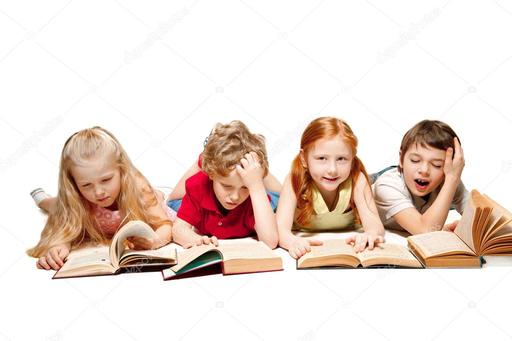 The kids boy and girls laying with books isolated on white