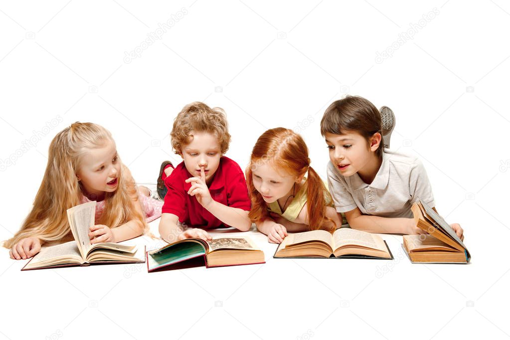 The kids boy and girls laying with books isolated on white