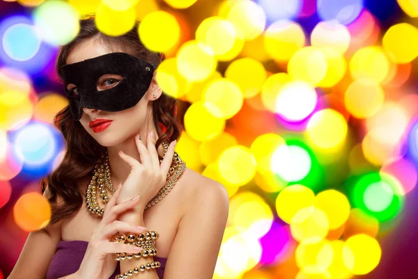 Beauty model woman wearing venetian masquerade carnival mask at party — Stock Photo, Image