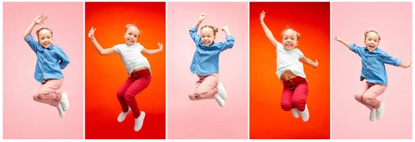 Молодая счастливая кавказская девочка-подросток, прыгающая в воздух, изолированная на розовом фоне студии . — стоковое фото