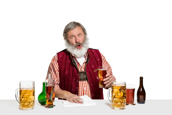 Expert barman with beer at studio — Stock Photo, Image