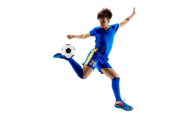 Young boy with soccer ball doing flying kick — Stock Photo, Image