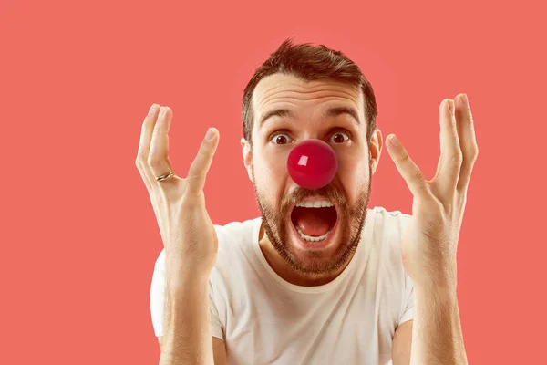 Happy man on red nose day.