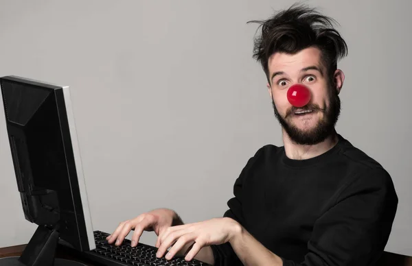 Happy man on red nose day.