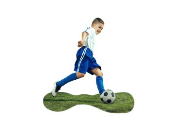 Young boy kicks the soccer ball clipart