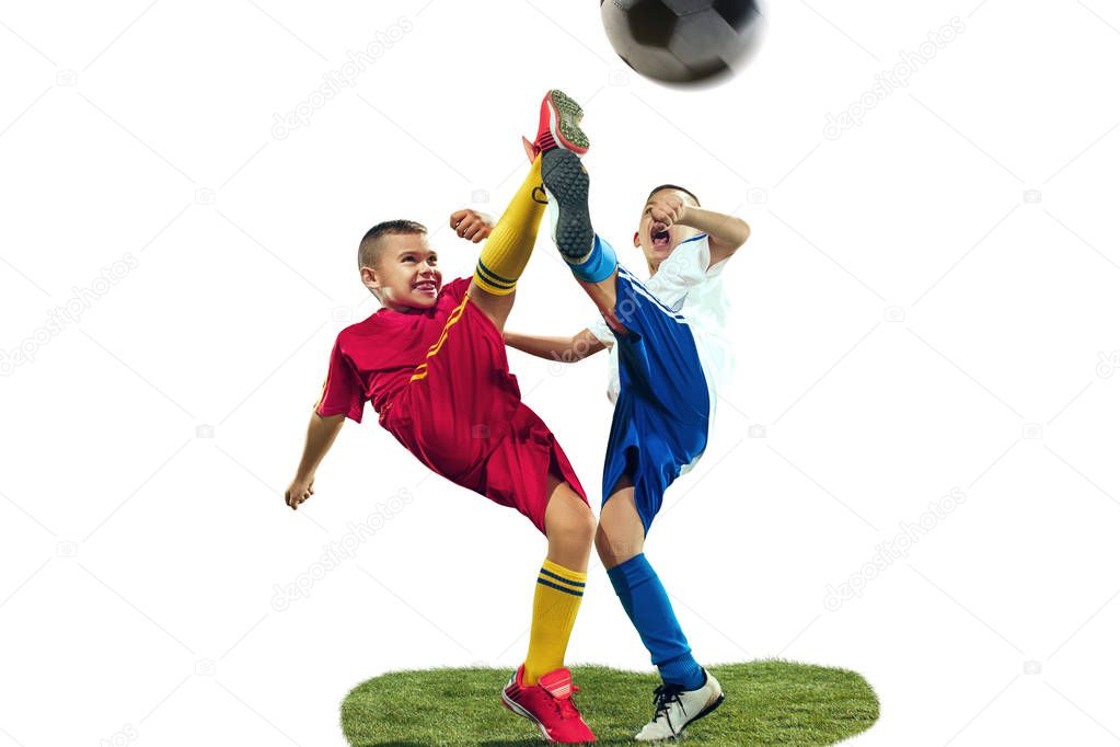 Young boys kicks the soccer ball