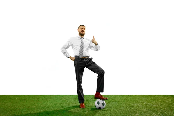 Full length shot of a young businessman playing football isolated on white background — Stock Photo, Image