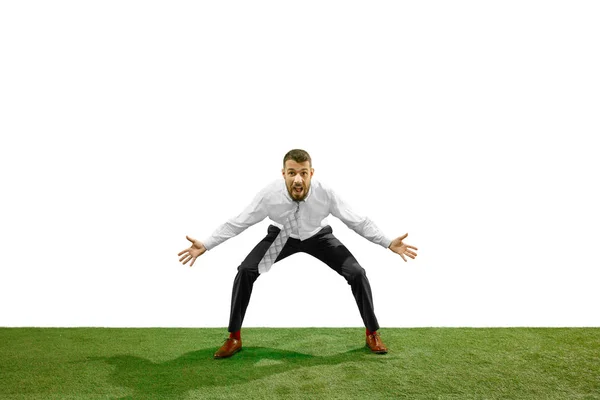 Full length shot of a young businessman playing football isolated on white background — Stock Photo, Image