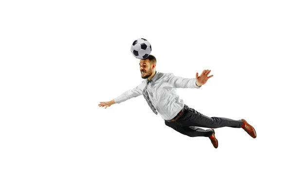 Aufnahme eines jungen Geschäftsmannes, der isoliert auf weißem Hintergrund Fußball spielt — Stockfoto