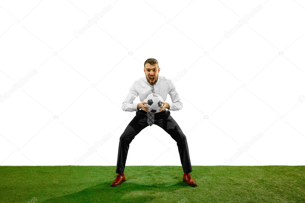 Full length shot of a young businessman playing football isolated on white background