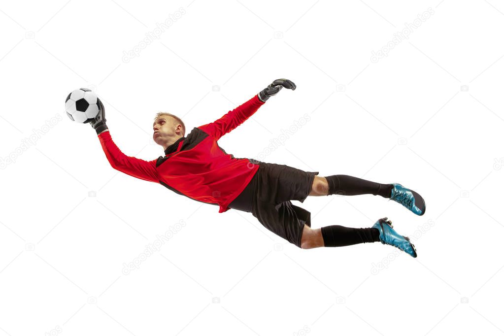 Male soccer player goalkeeper catching ball in jump. Silhouette of fit man with ball isolated on white studio background