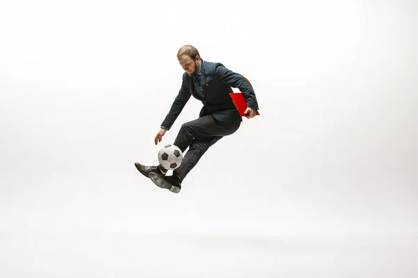 Zakenman met voetbal in functie — Stockfoto