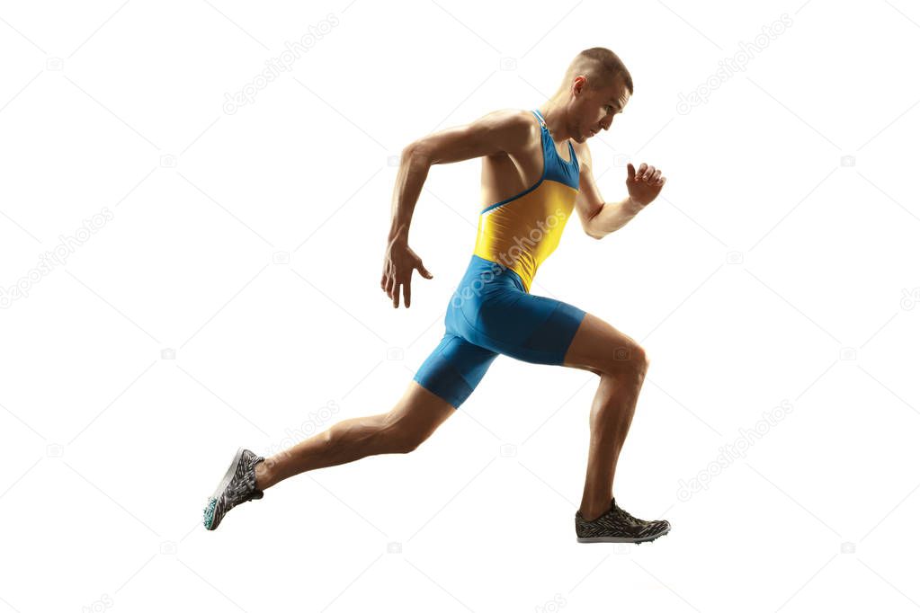 Young caucasian man running or jogging isolated on white studio background.