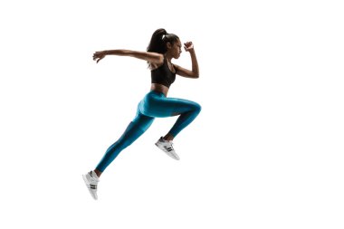 Young african woman running or jogging isolated on white studio background. clipart
