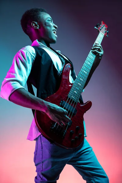African American jazz musician playing bass guitar. — Stock Photo, Image