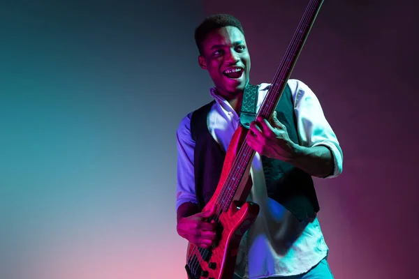 African American jazz musician playing bass guitar. — Stock Photo, Image