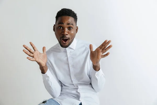 Portrait of excited young African American male screaming in shock and amazement. — Stock Photo, Image