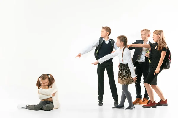 Little girl sitting alone on floor and suffering an act of bullying. — Stock Photo, Image