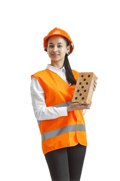 Le constructeur féminin en casque orange isolé sur blanc — Photo