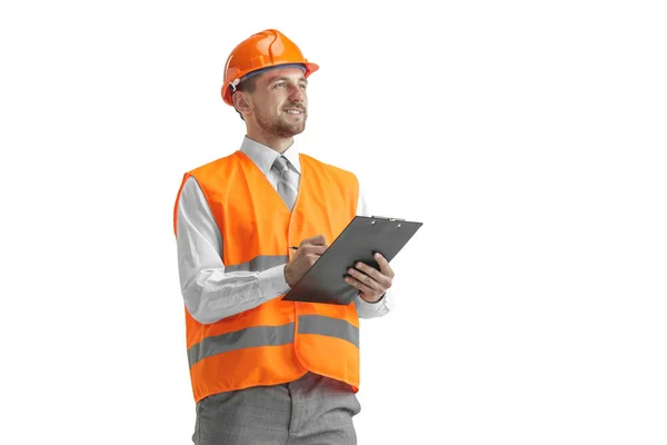 O construtor em capacete laranja isolado em branco — Fotografia de Stock