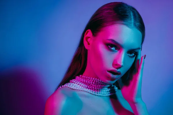 High Fashion model in colorful bright neon lights posing at studio — Stock Photo, Image