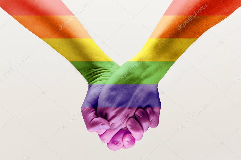  loseup of a gay couple holding hands, patterned as the rainbow flag