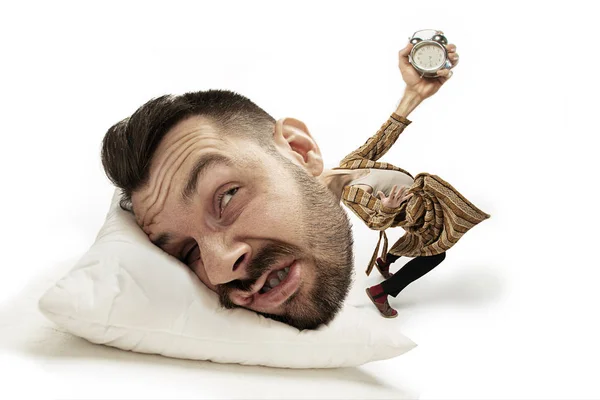 Big head on small body lying on the pillow — Stock Photo, Image