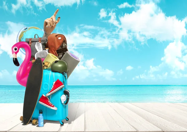 Collage of luggage for travel in front of ocean view — Stock Photo, Image
