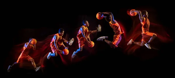 黑暗背景下的年轻篮球运动员 — 图库照片