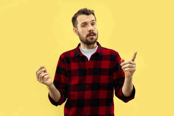 Half-length close up portrait of young man on yellow background. — Stock Photo, Image