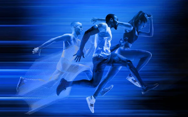 Young african-american and caucasian men and woman running isolated on blue studio background