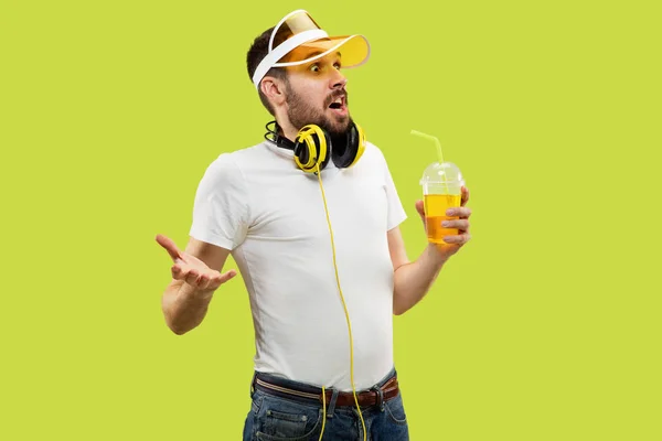 Half-length close up portrait of young man on yellow background — Stock Photo, Image