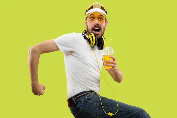 Half-length close up portrait of young man on yellow background — Stock Photo, Image