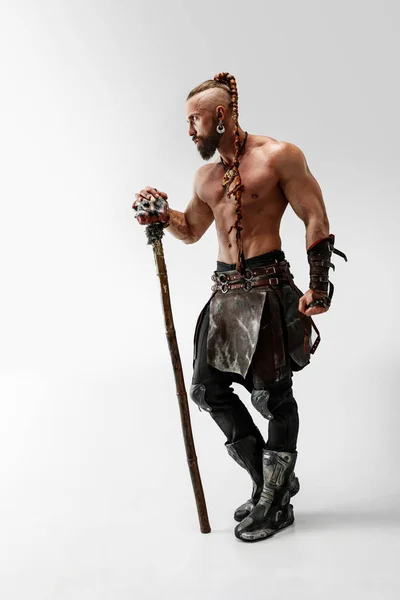 Man in leather vikings costume isolated on white studio background — Stock Photo, Image