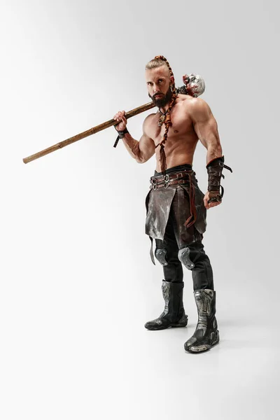 Man in skin vikings costum isolated on white studio background — Stok Foto