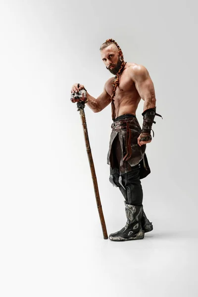 Man in leather vikings costume isolated on white studio background — Stock Photo, Image