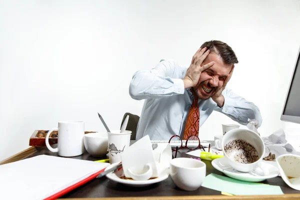 Young man suffering from the noise in the office — 스톡 사진