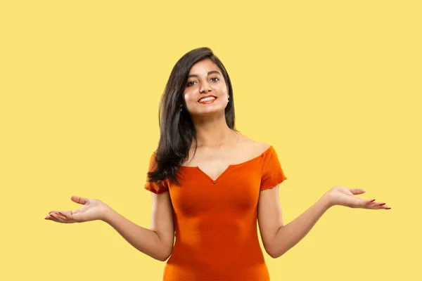 Portrait of beautiful woman isolated on yellow studio background — Stock Photo, Image