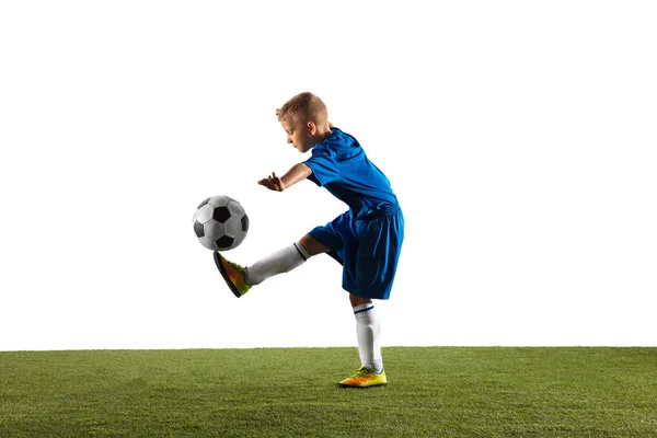 Jonge jongen als voetbal of voetbalspeler op witte studio achtergrond — Stockfoto