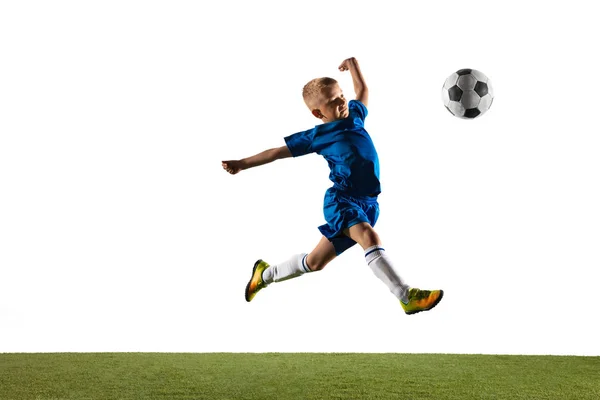 Young boy as a soccer or football player on white studio background — Stock Photo, Image