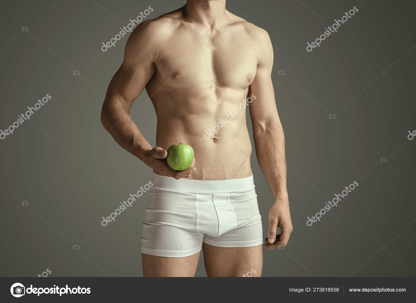 Perfect slim toned young body of the man Stock Photo by