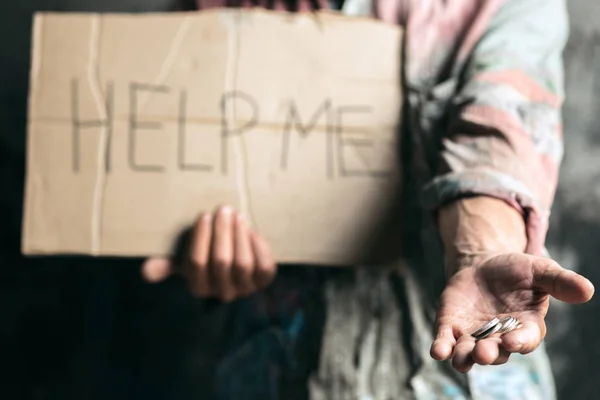 Male beggar hands seeking money on the wooden floor at public path way — Stock Photo, Image