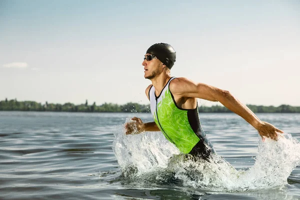 Professional triathlete swimming in rivers open water