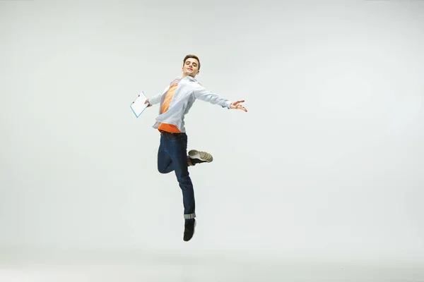 Office worker jumping isolated on white studio background — Stock Photo, Image