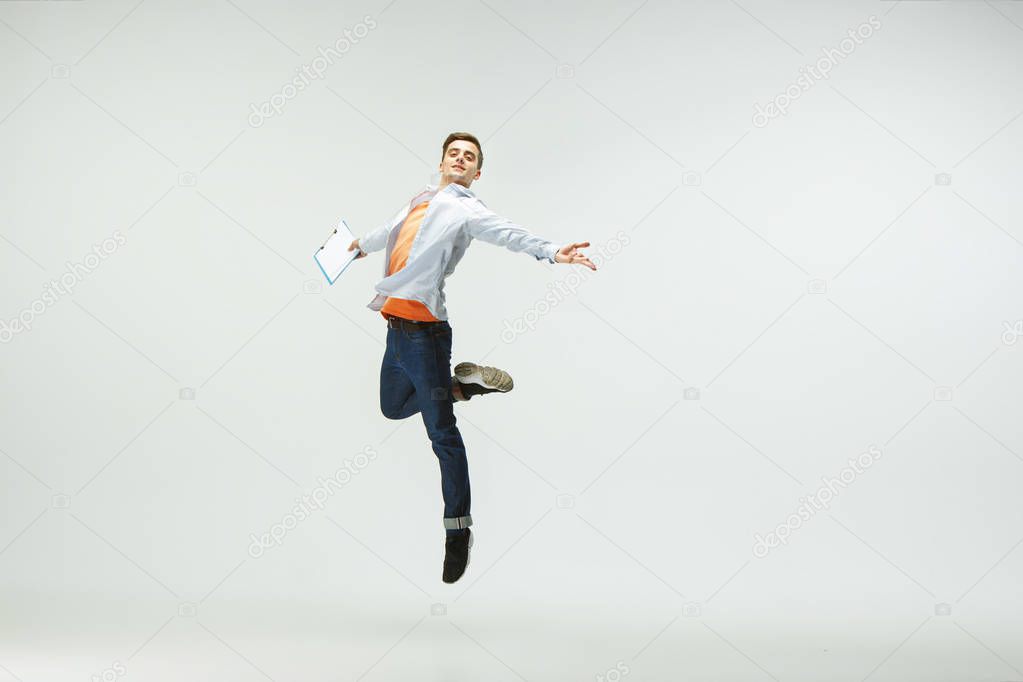 Office worker jumping isolated on white studio background