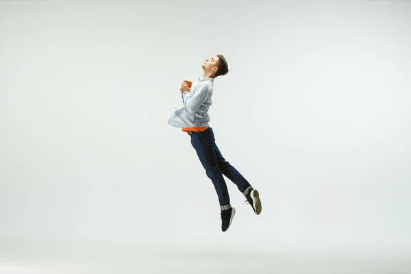 Office worker jumping isolated on white studio background — Stock Photo, Image