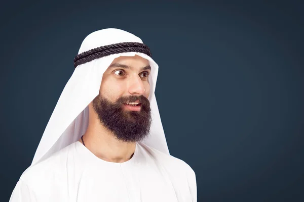 Arabian saudi businessman on dark blue studio background — Stock Photo, Image